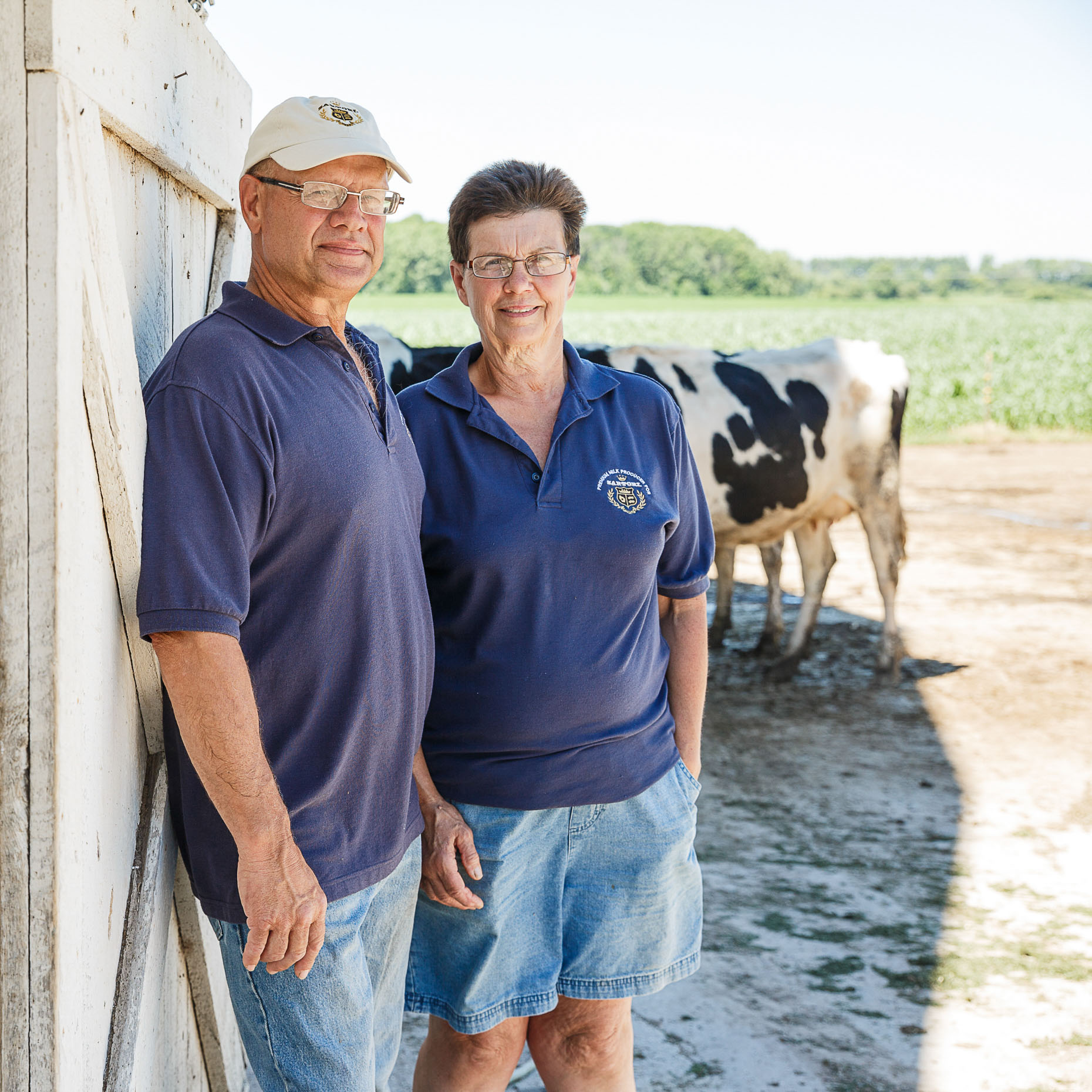Dairy farmers Scott and Paulette Ditter stand in front of their barn in Plymouth, Wisconsin on July 2nd, 2018.