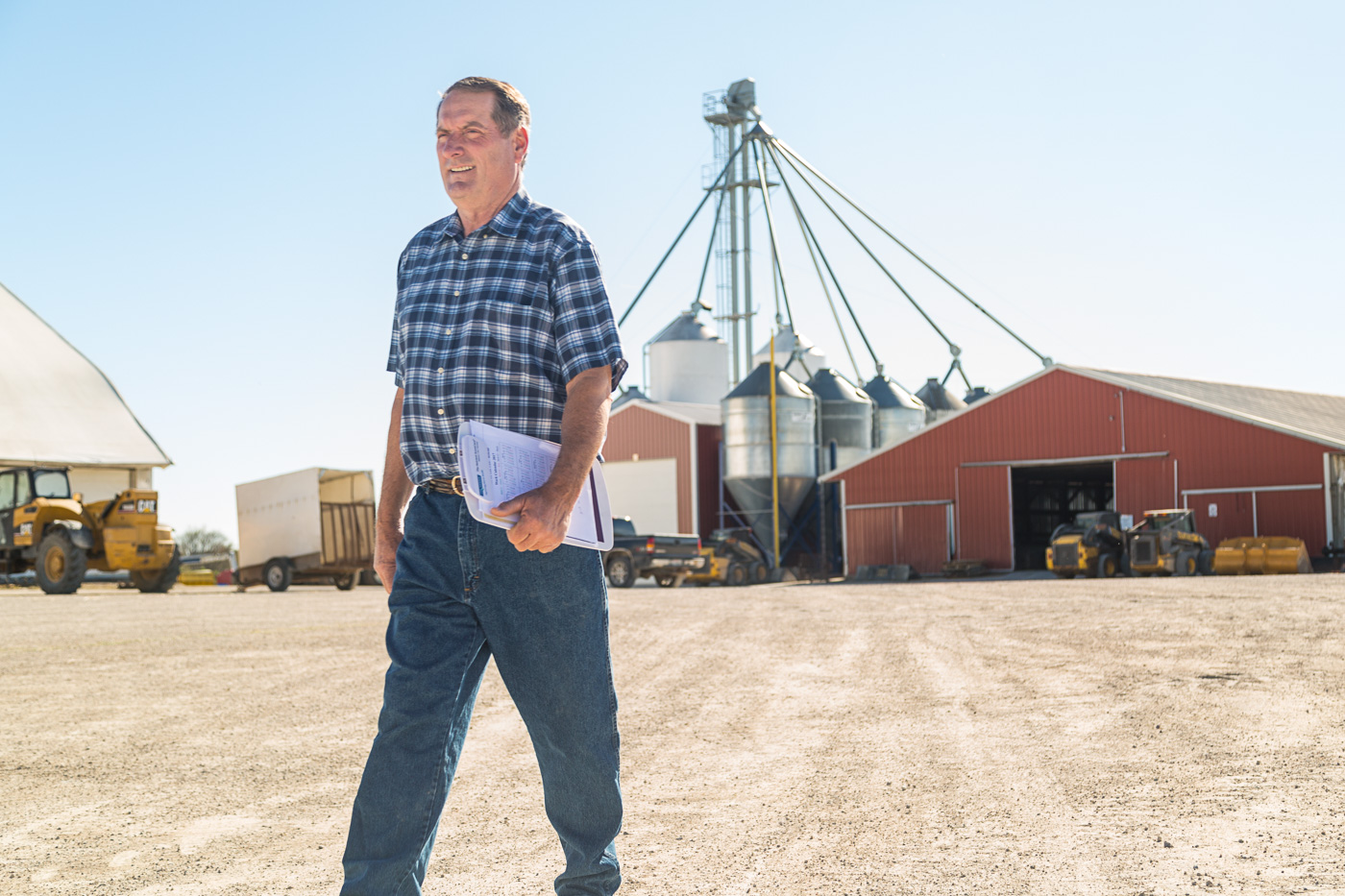agriculture photographer - a Wisconsin dairy farms walks on his farm