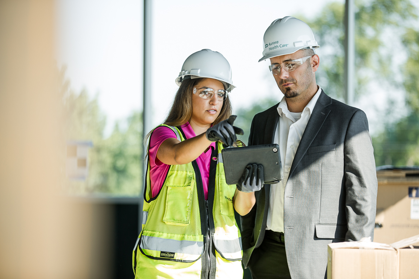 commercial photographer Midwest - a construction worker and a client talk on a construction site