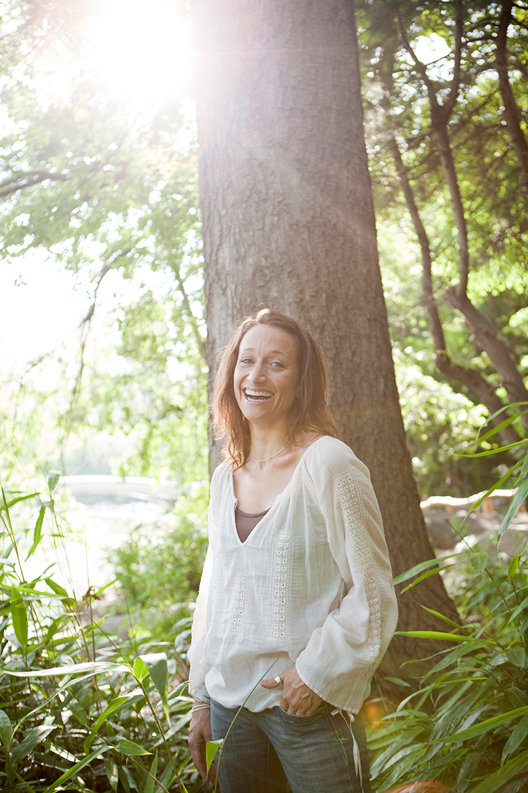 commercial photographer Milwaukee - portrait of Celine Cousteau standing in the woods
