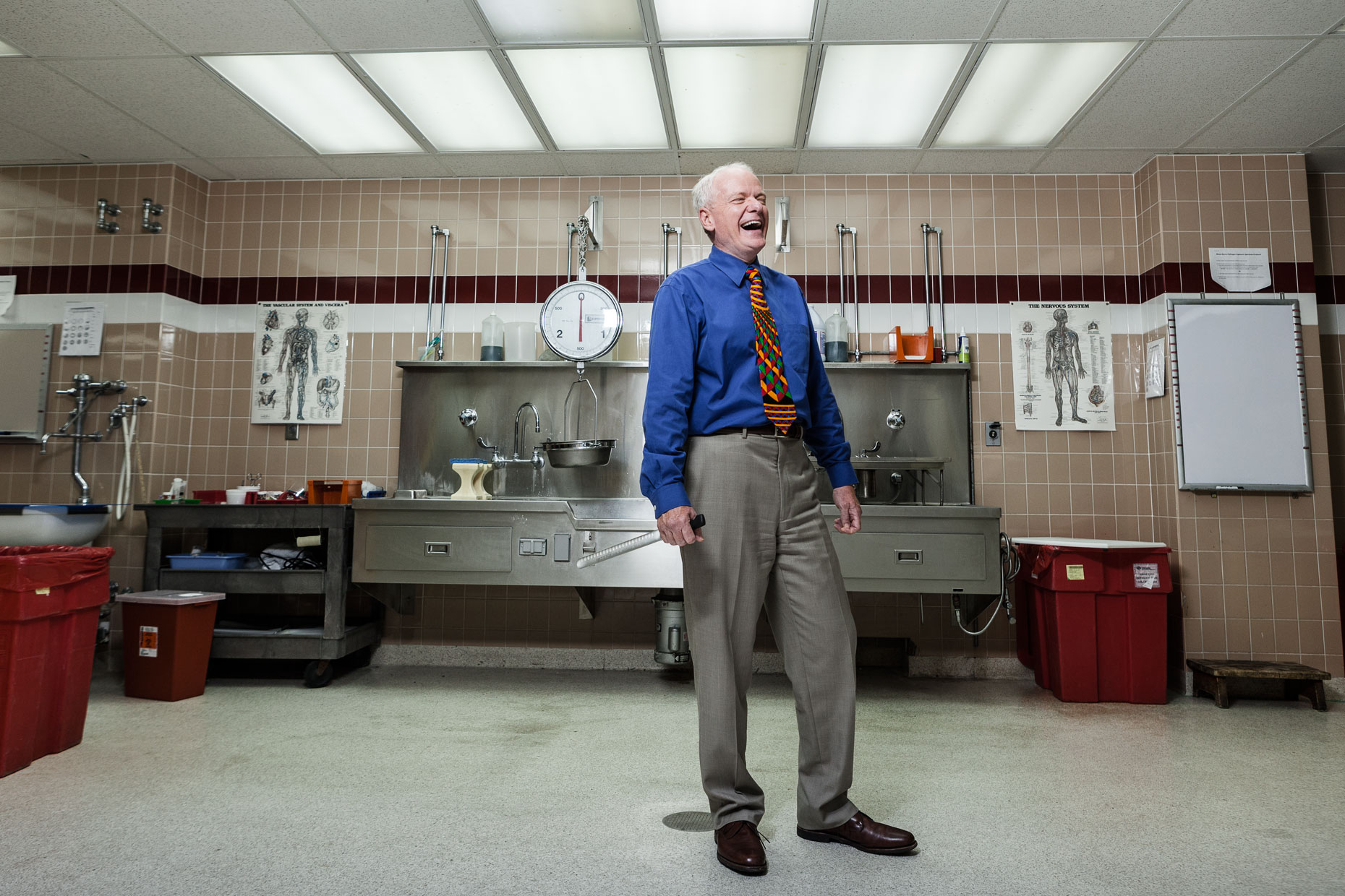 editorial photographer Milwaukee - Dr. Brian Peterson, Milwaukee County Medical Examiner, stands in the morgue