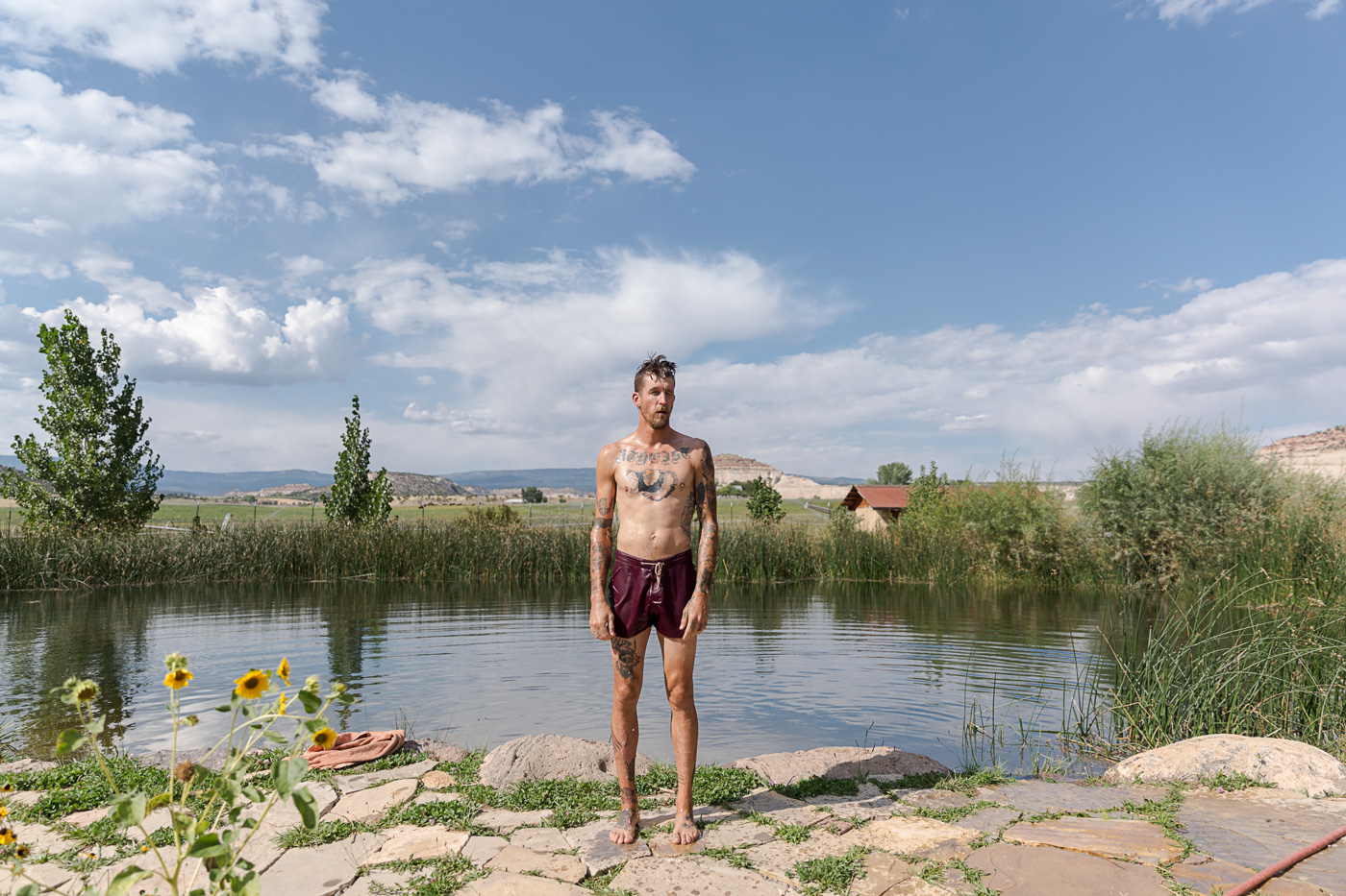 portrait photographer - a farmer stands at the pond after a swim at Hell