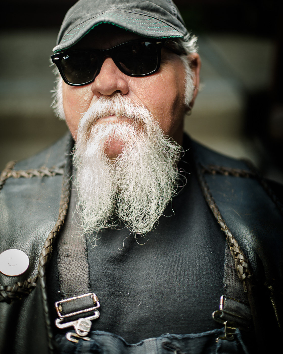editorial portrait photographer - close up portrait of a biker with sunglasses and grey beard