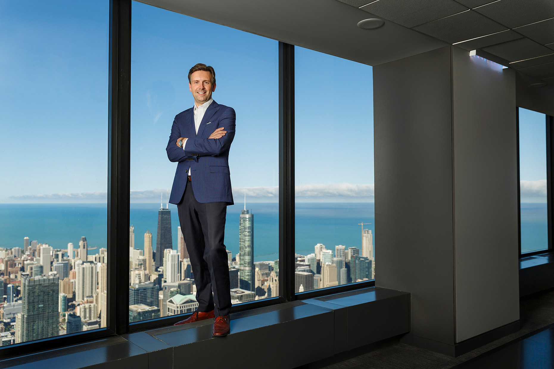 Corporate photographer  - Josh Earnest of United Airlines with the Chicago skyline
