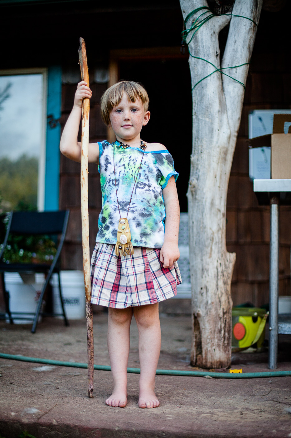 Sara Stathas portrait photographer - a young farmer girl stands on the porch