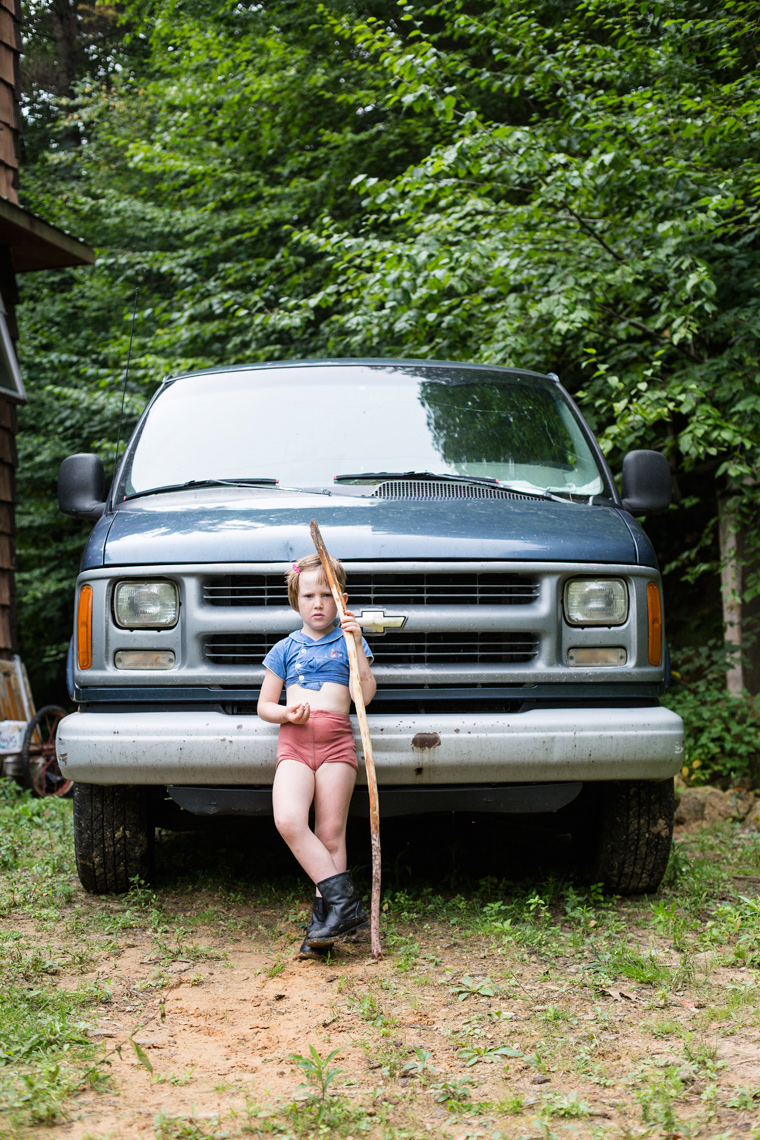 Sara Stathas portrait photographer - portrait of a young farm girl in front of a pick up truck