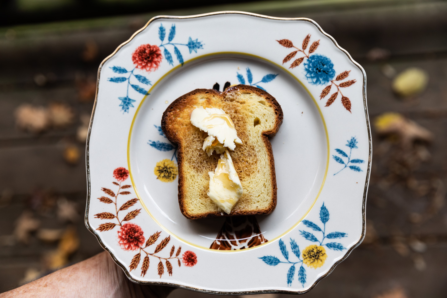 food photographer Midwest - Local maple syrup is drizzled on top of a toasted slice of buttered homemade brioche bread at the Milkweed Inn
