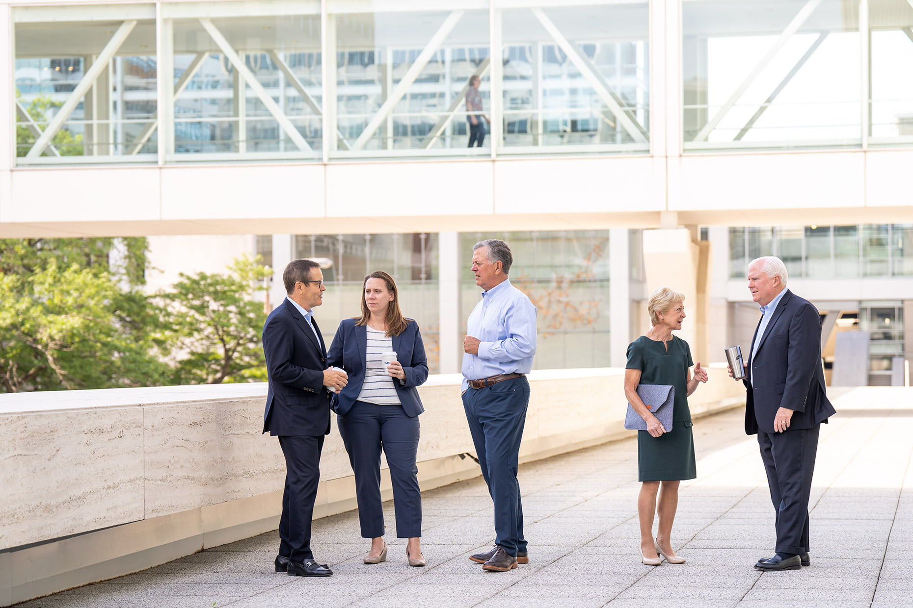 A group of employees at Robert W. Baird & Co. having a meeting A group of employees at Robert W. Baird & Co. Private Wealth Management team having a meeting
