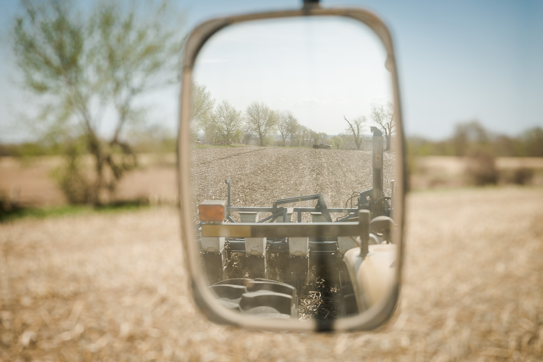 agriculture photographer Midwest - view of a farm field from the side mirror of a tractor