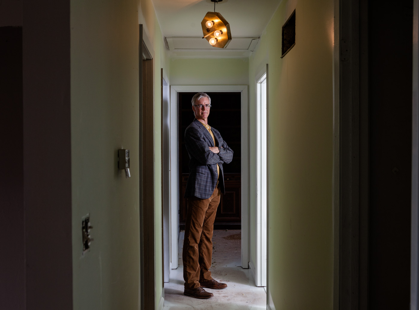 editorial photographer - Rob Bloemker of Five Ten Capital inside a house being remodeled