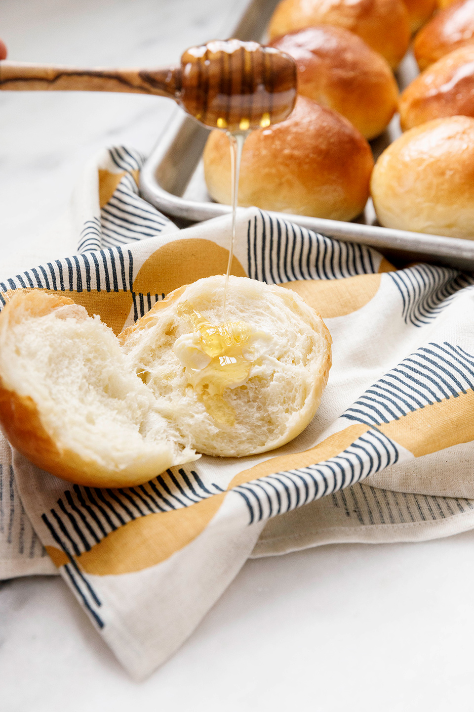 commercial food photographer - honey drizzled on milk bread rolls baked by Gesine Bullock-Prado